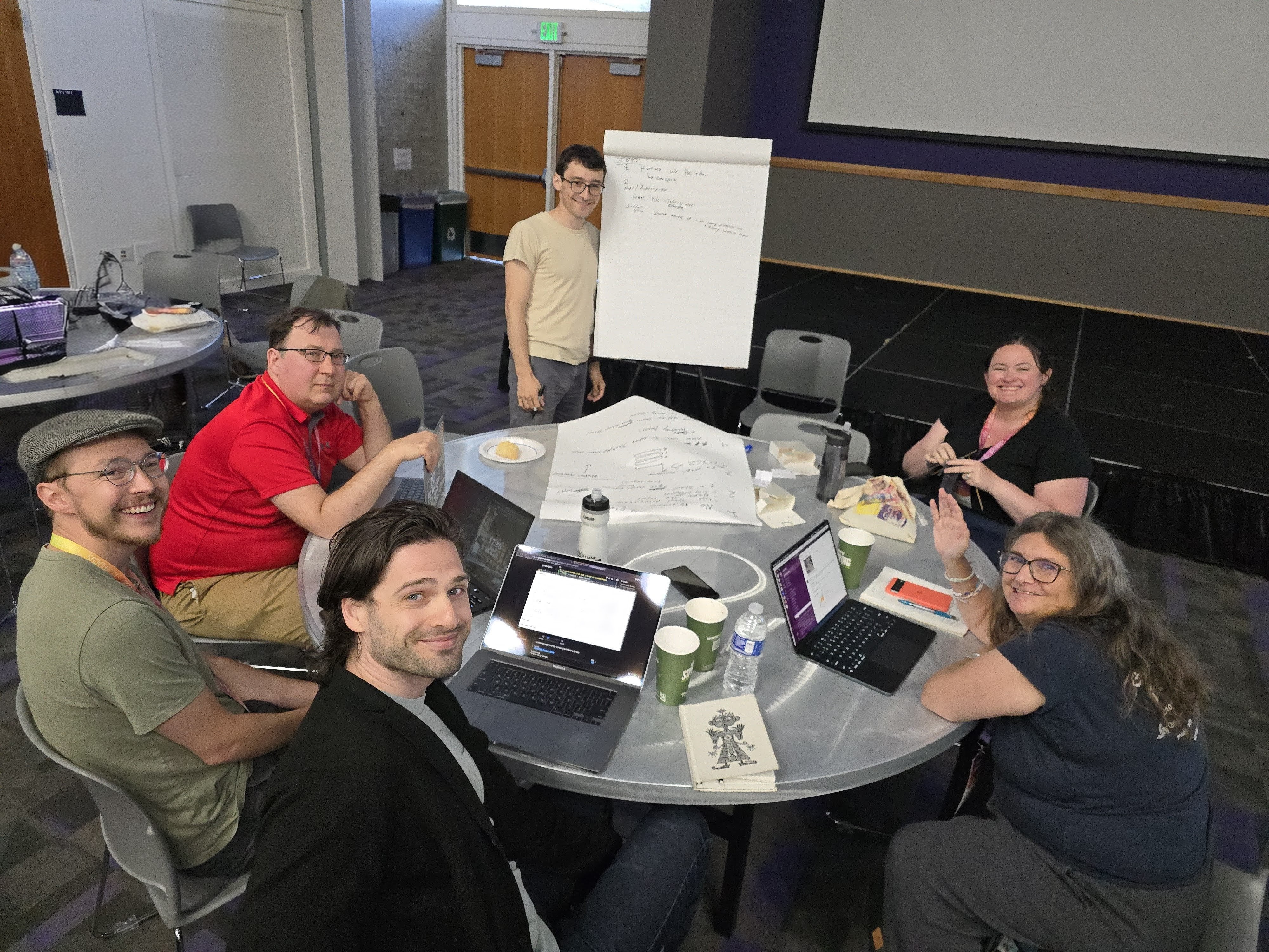 SciPy 2025 sprint participants from napari, Xarray, and CellProfiler teams collaborating on the development roadmap